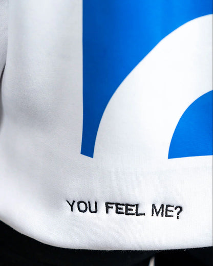 White shirt with blue design and text 'YOU FEEL ME?' on a black background