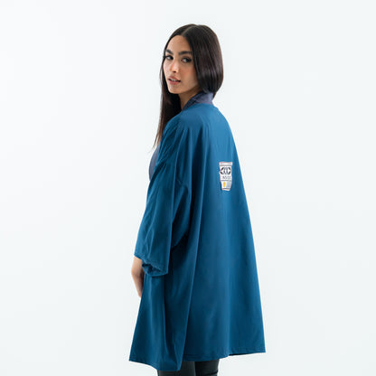 Woman wearing a blue robe with a logo on a white background