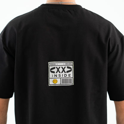 Black t-shirt with a label on the back featuring text and graphics.