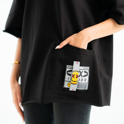 Black t-shirt with a unique pocket design featuring text and graphics.