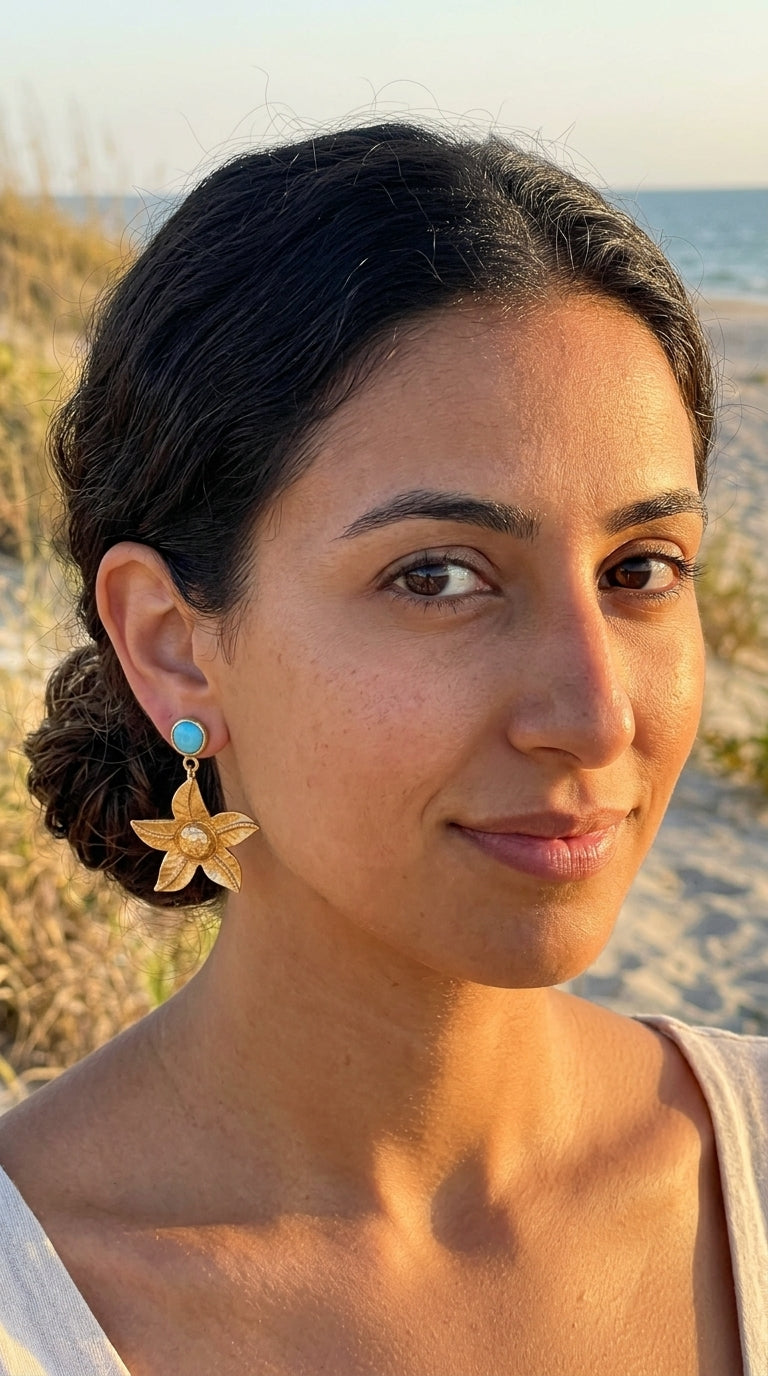 Woman with floral earrings on a beach