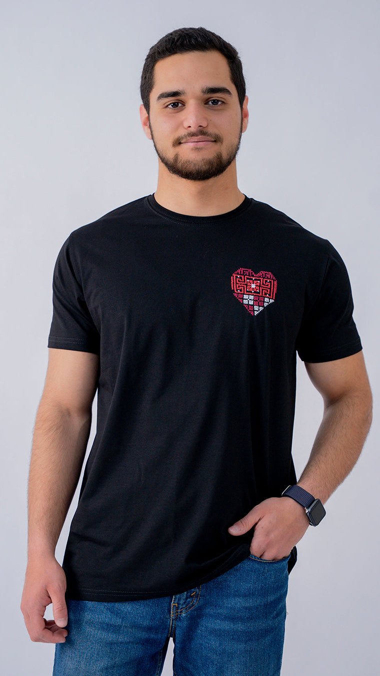 Man wearing a black t-shirt with a red logo on a white background