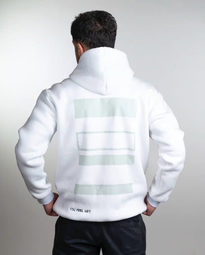 Person wearing a white hoodie with text on the back against a light gray background