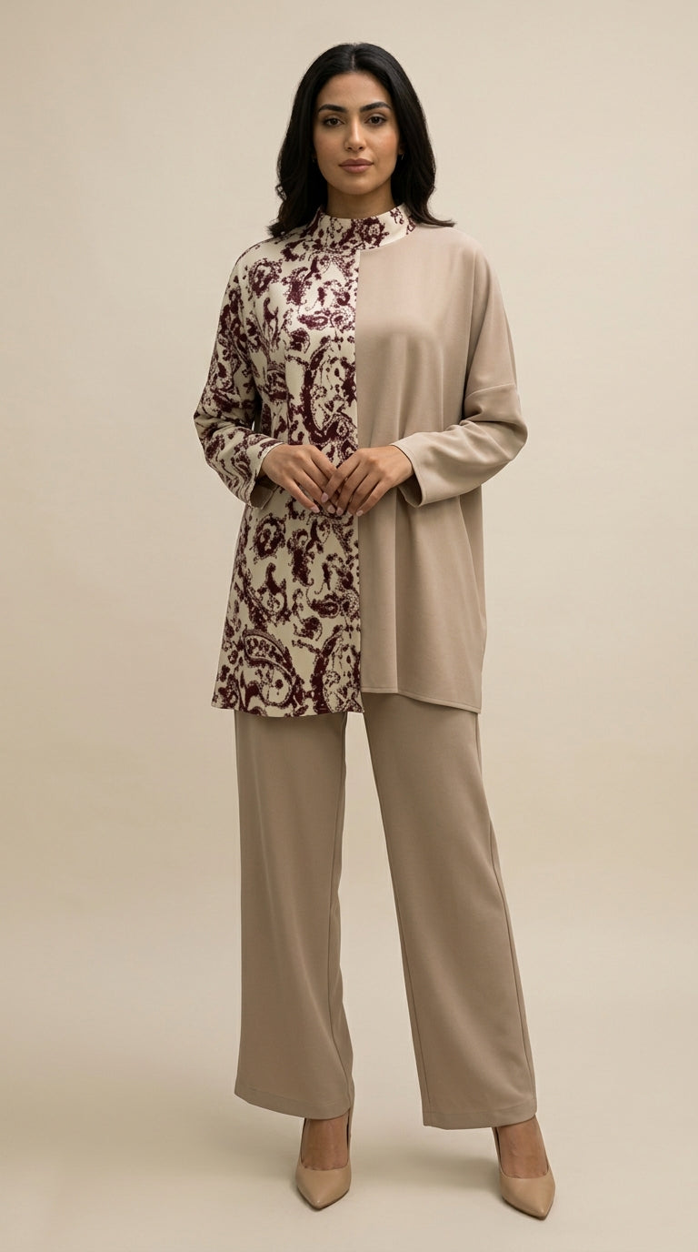 Woman wearing a beige and floral outfit on a beige background