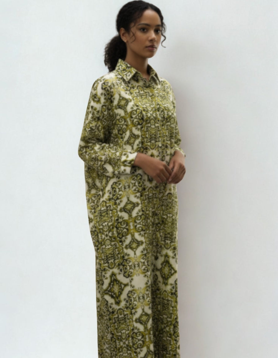 Woman wearing a green patterned dress against a white background