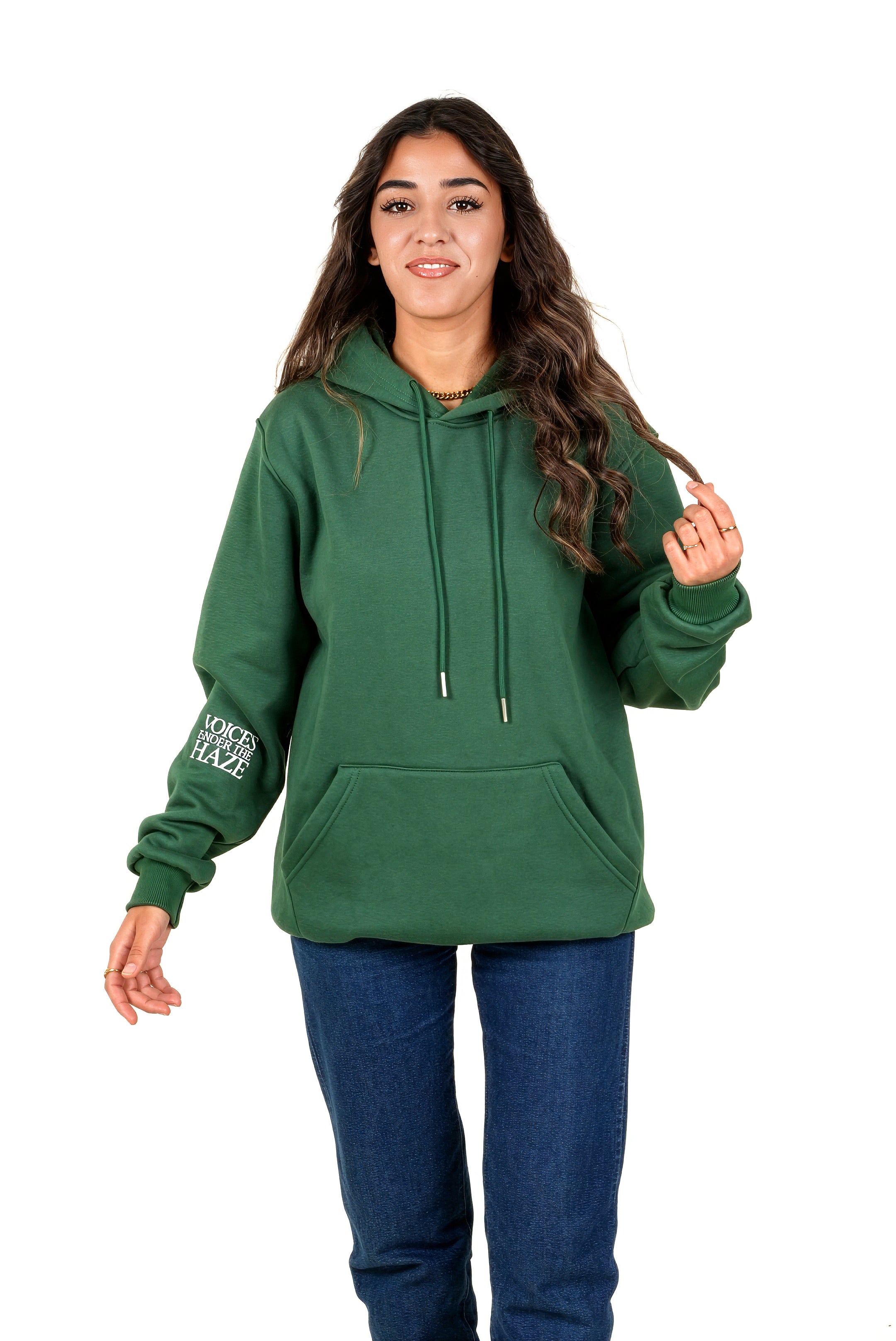 Person wearing a green hoodie with a logo on the sleeve against a white background