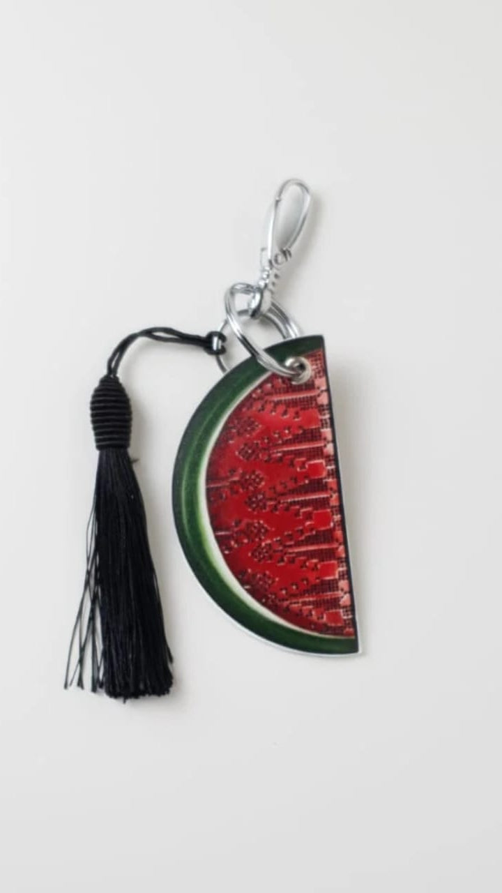 Keychain with watermelon design and tassel on a white background