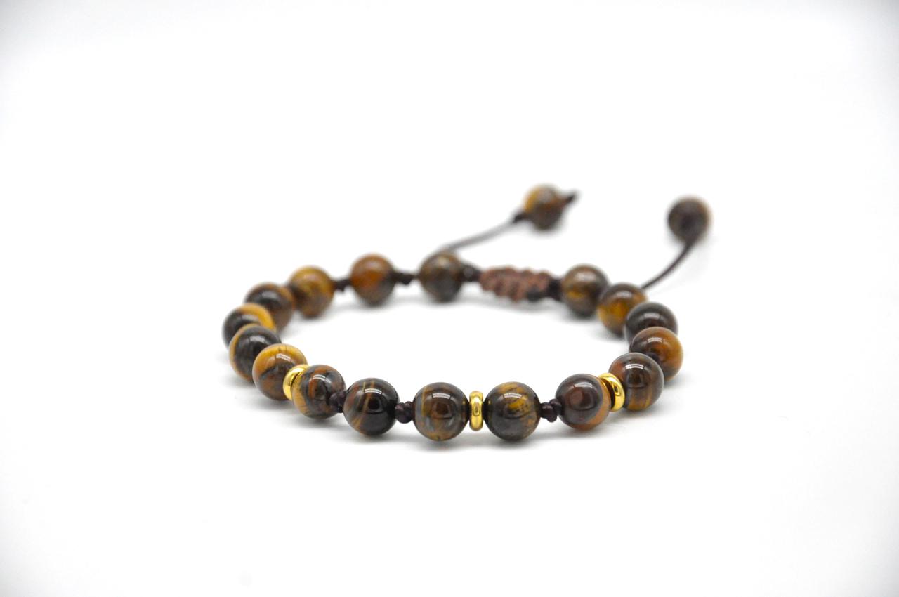 Beaded bracelet with brown and yellow tiger eye stones on a white background