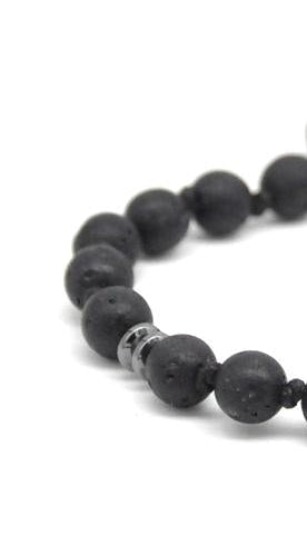 Black beaded bracelet on a white background