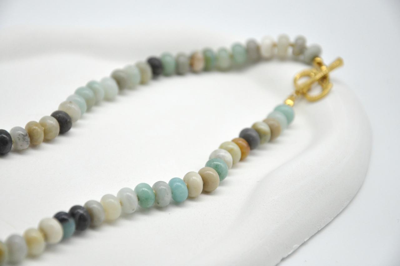 Beaded necklace with a gold clasp on a white background