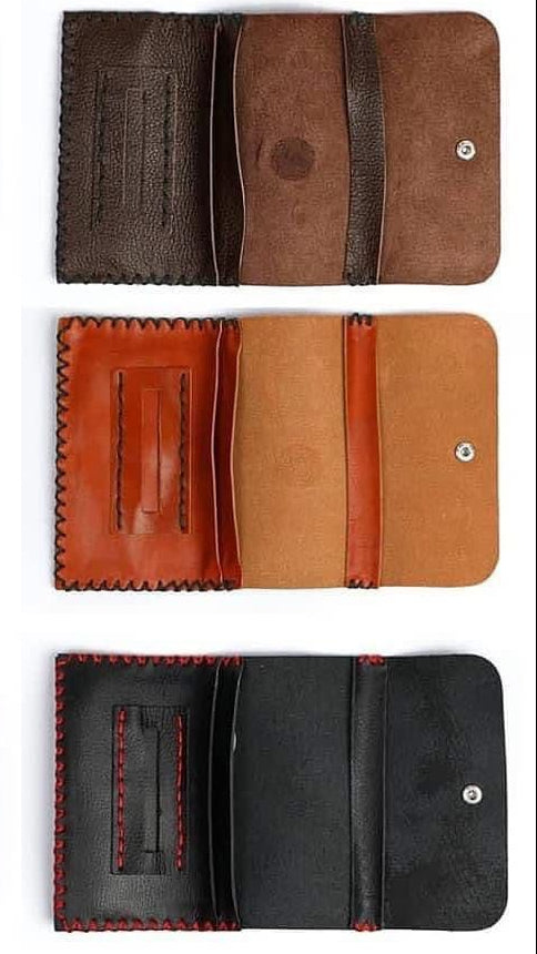 Collection of leather wallets in different colors on a white background