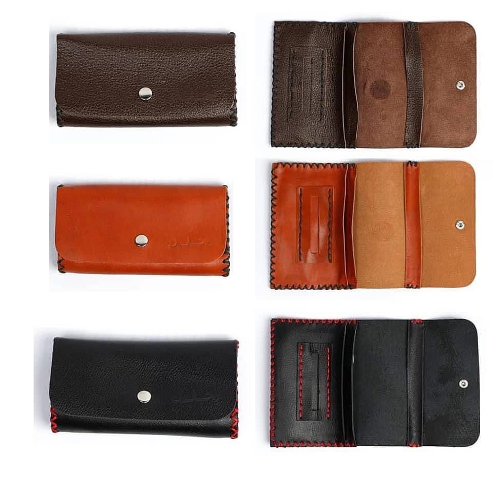 Collection of leather wallets in different colors on a white background