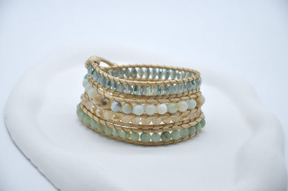 Stack of beaded bracelets on a white background