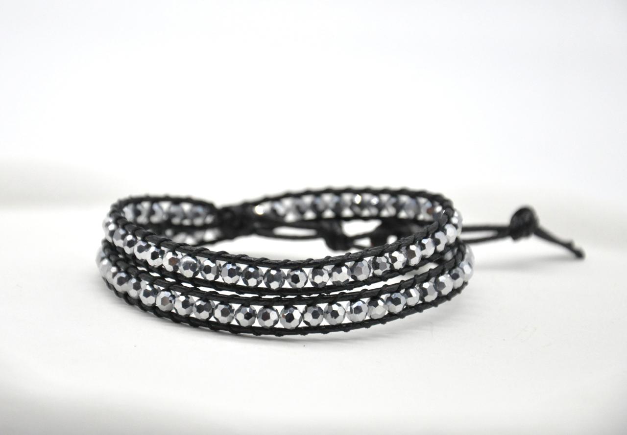 Multistrand bracelet with crystal beads on a white background
