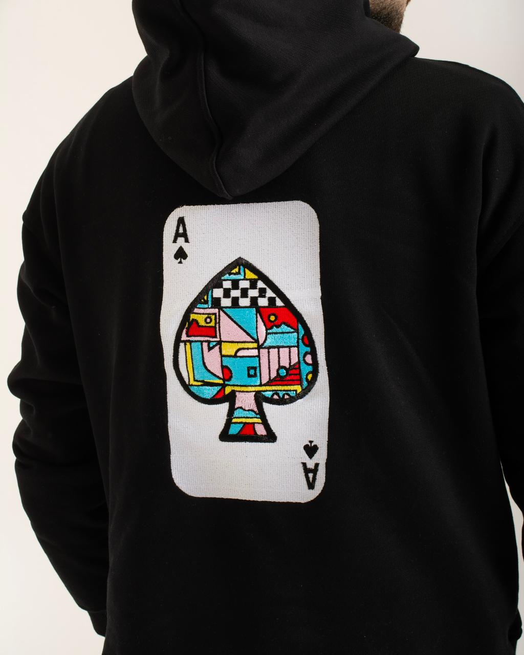 Black hoodie with a colorful ace of spades card design on the back.