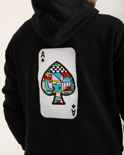 Black hoodie with a colorful ace of spades card design on the back.