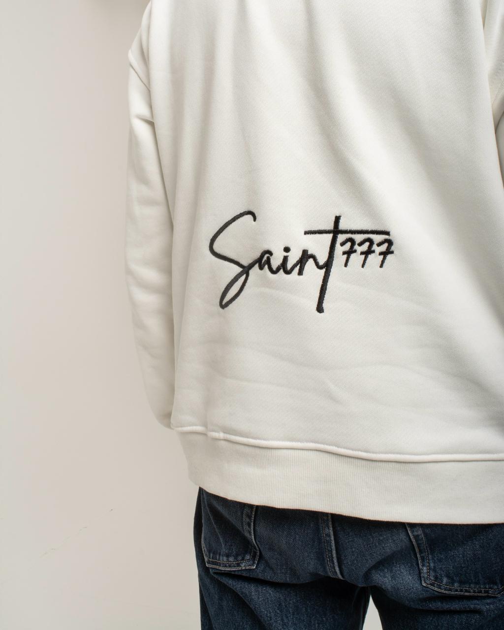 White sweatshirt with 'Saint 777' text on a plain background