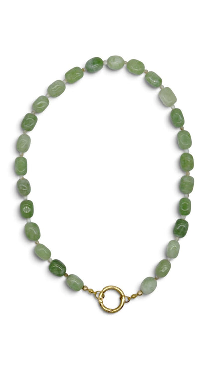 A beaded necklace made of small, irregular green stone beads with a gold-tone split ring clasp, displayed on a clean white background.