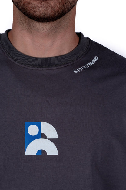 Black t-shirt with a logo and text on a white background