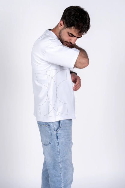 Man wearing a white jacket and light blue jeans on a white background