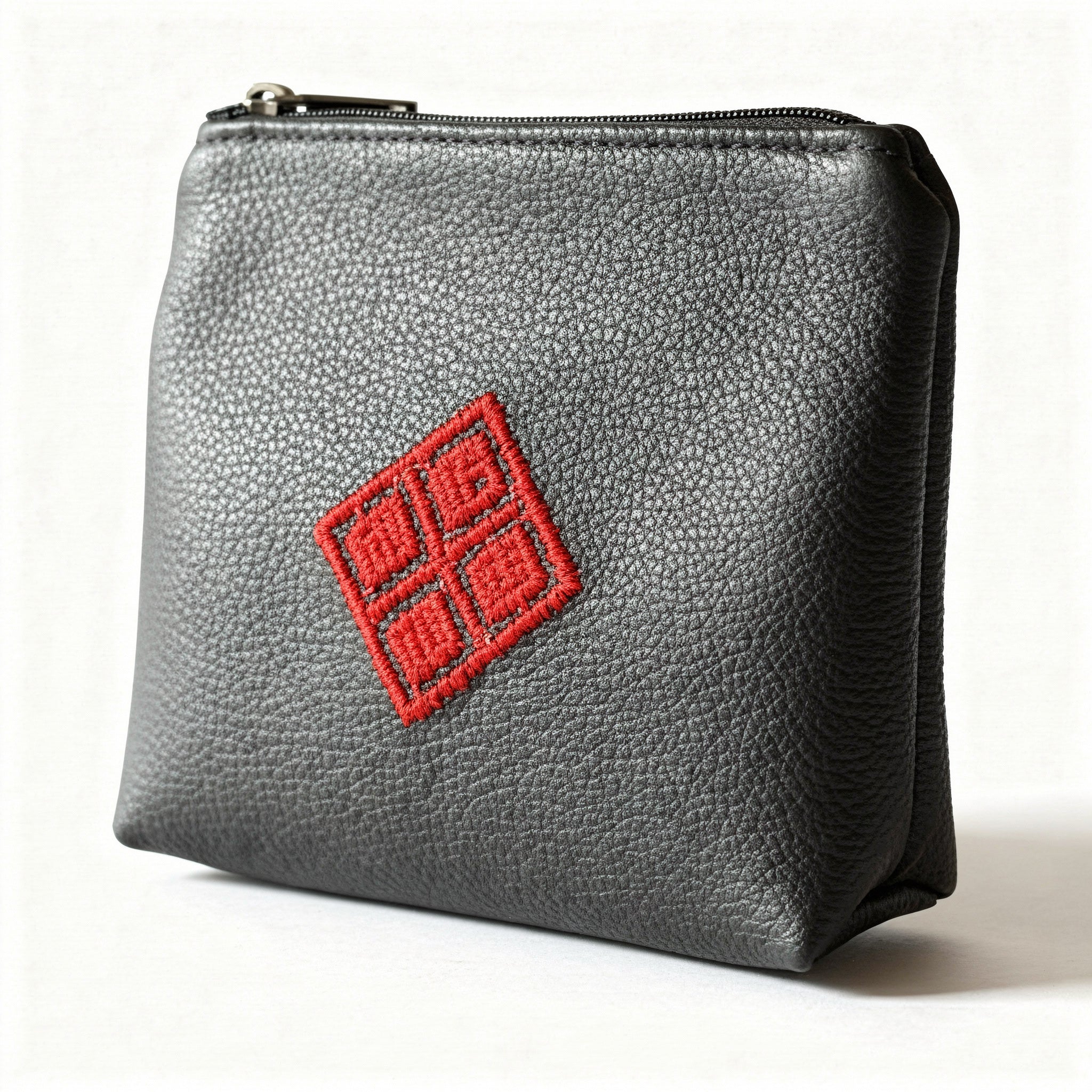 black leather pouch with a red logo on a white background