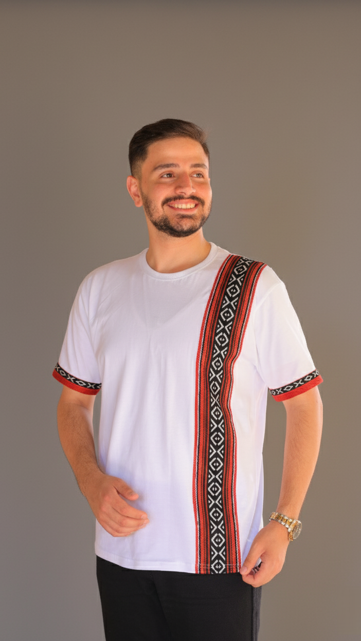 Man wearing a white shirt with colorful embroidery on a gray background