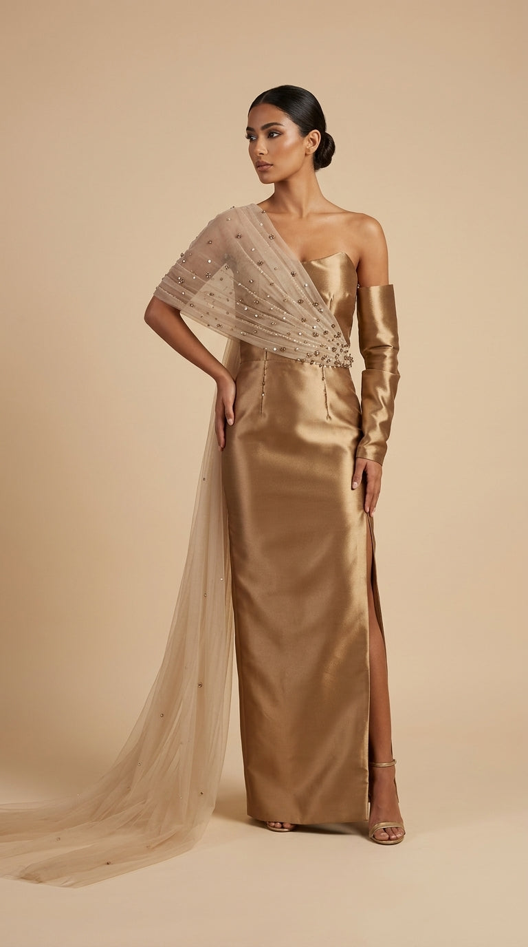Woman wearing a gold evening gown with a sheer overlay against a beige background