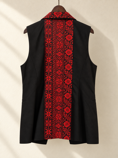 Black Sleeveless Blazer Vest with Red Embroidered Collar — back view on wooden hanger