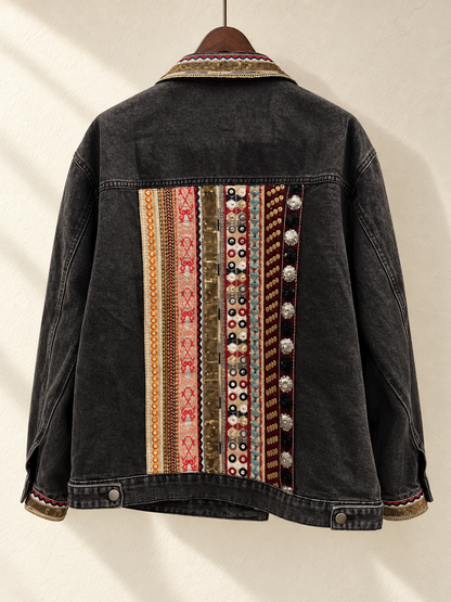 Black Denim Jacket with Beaded Embroidered Back Panel — back view on wooden hanger
