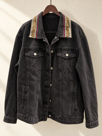 Black Denim Jacket with Beaded Embroidered Back Panel — front view on wooden hanger