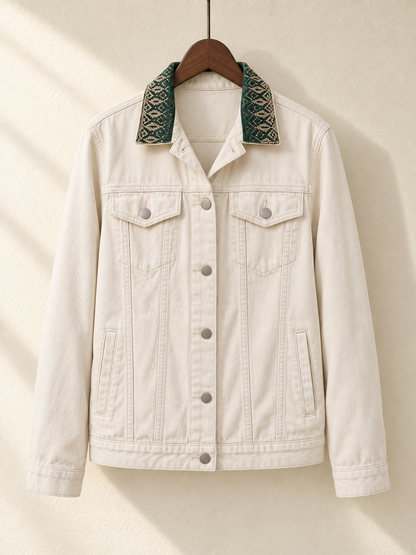 Cream Denim Jacket with Green Embroidered Back Panel — front view on wooden hanger