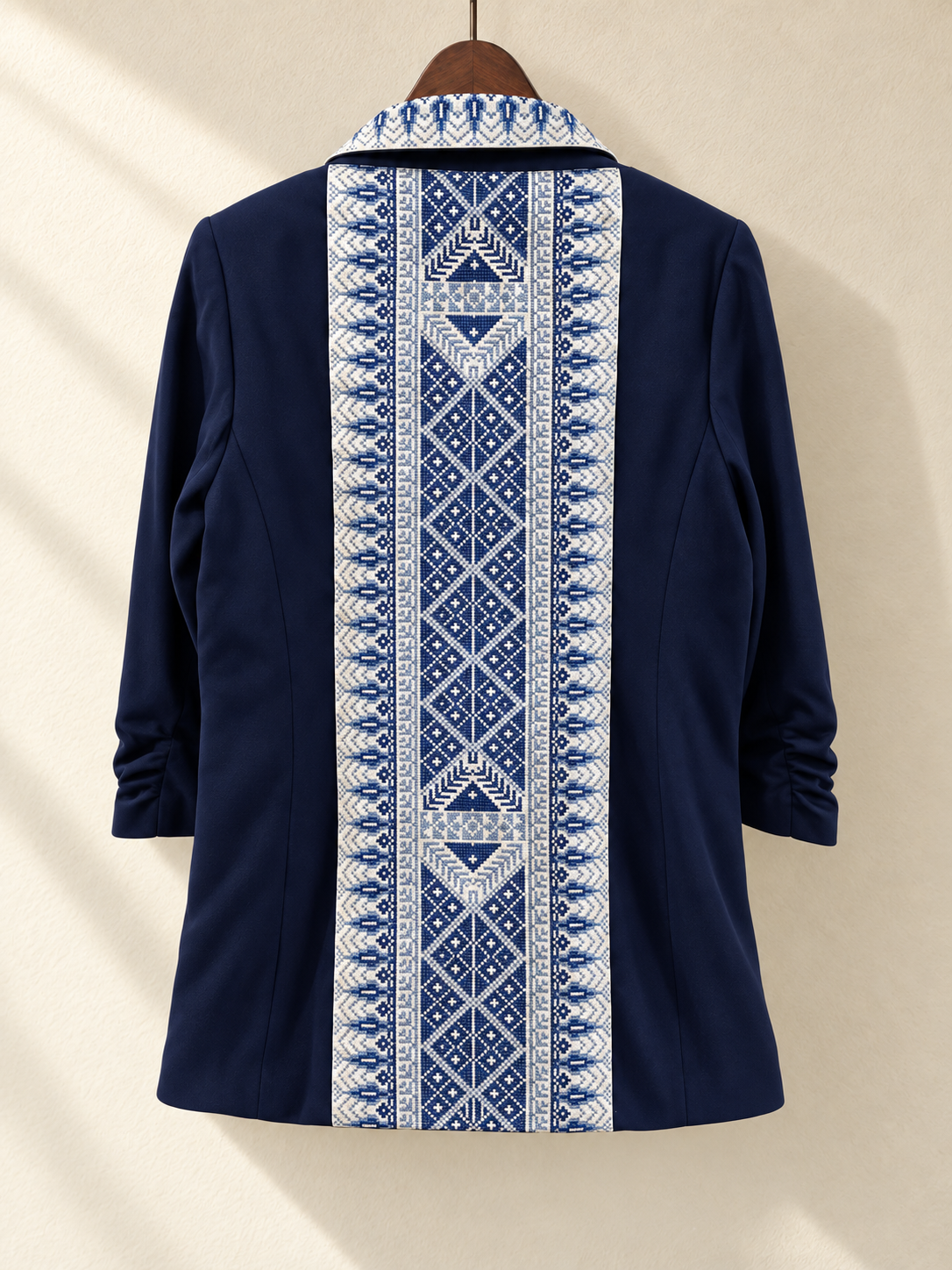 Navy Blue Embroidered Blazer — back view on wooden hanger