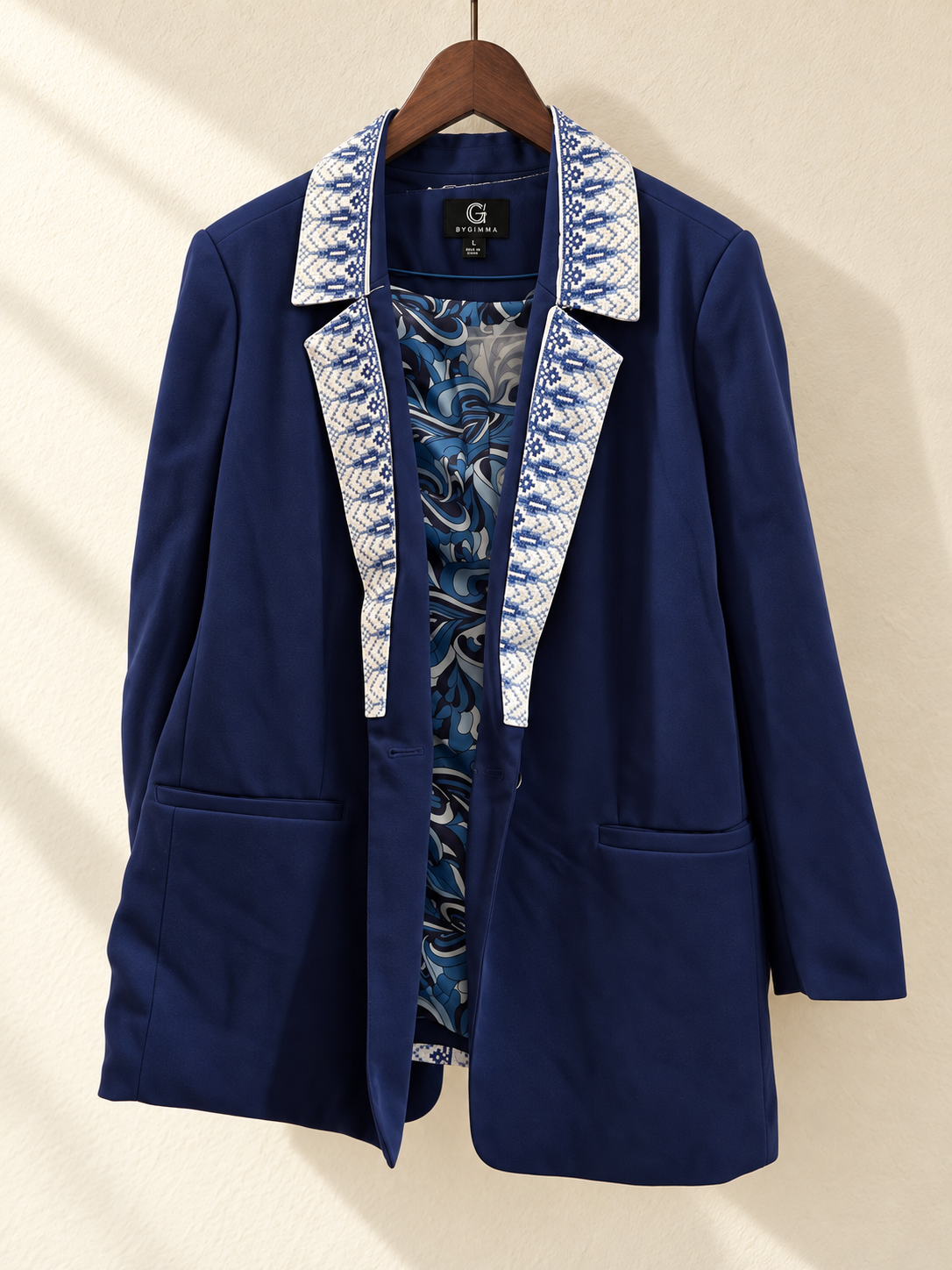 Navy Blue Embroidered Blazer — front view on wooden hanger